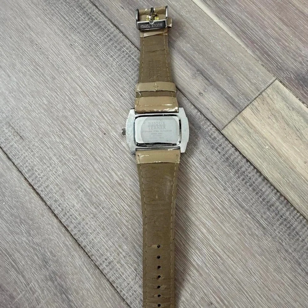 Tan leather watch with silver accents